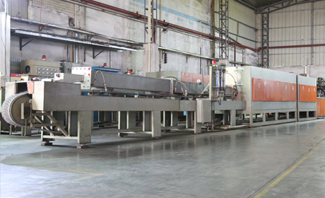 Metal powder compaction press in operation